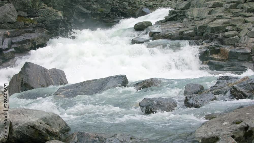 Super slow motion view of clean fresh raging water in mountain river Super slow motion view of clean fresh raging water in mountain river
