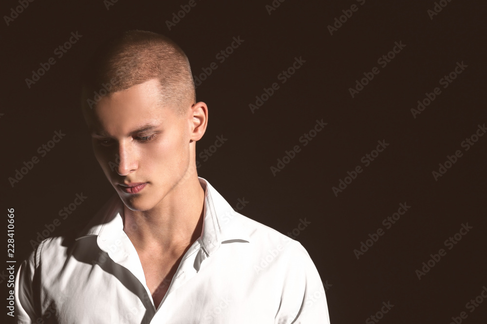 Sad teenage boy on dark background Sad teenage boy on dark background