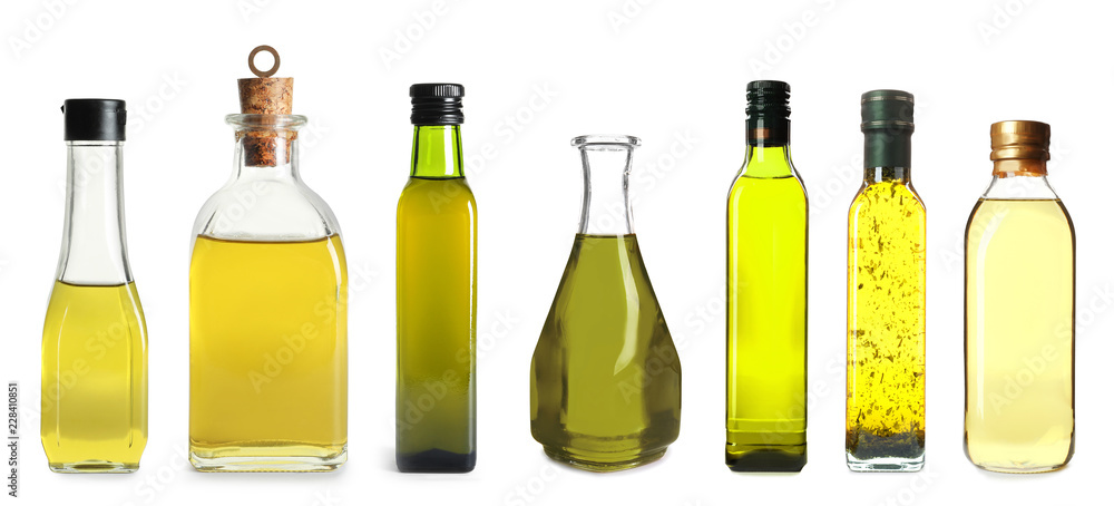 Set with bottles of different oils on white background Set with bottles of different oils on white background