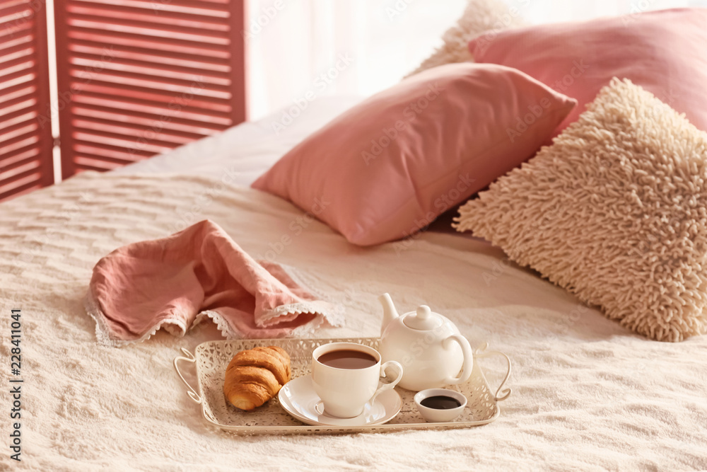 Tray with delicious breakfast on bed Tray with delicious breakfast on bed