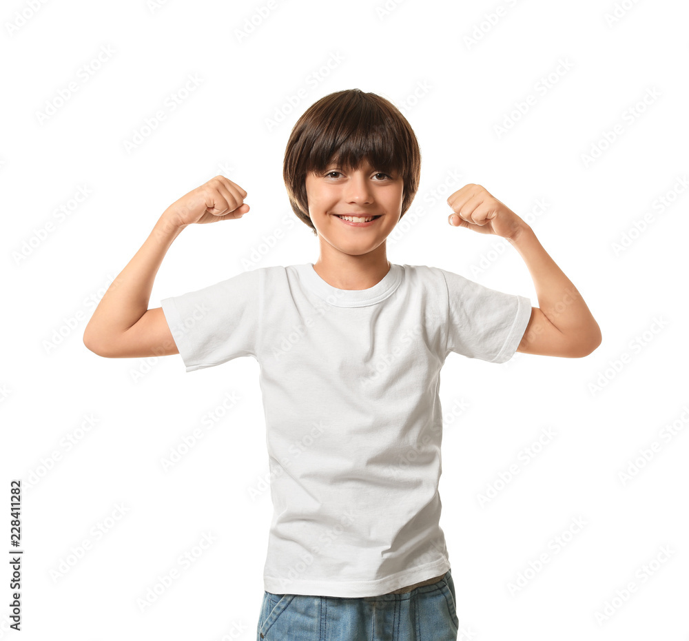 Little boy in t-shirt showing muscles on white background Little boy in t-shirt showing muscles on white background