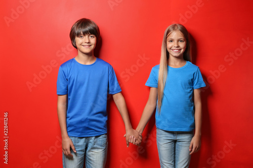 Boy and girl in t-shirts ho...