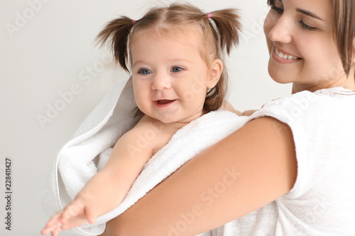 Young mother with cute litt...
