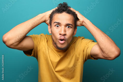 Portrait of shocked African...