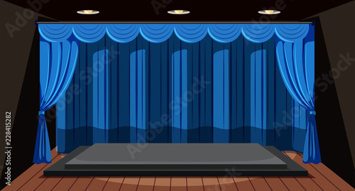 An empty stage with blue curtain