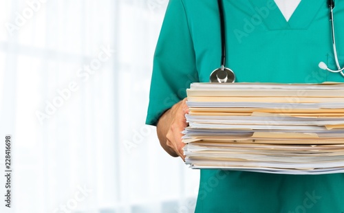 Medicine doctor man with documents ,closeup photo