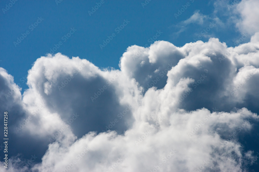 Blue sky with fluffy clouds