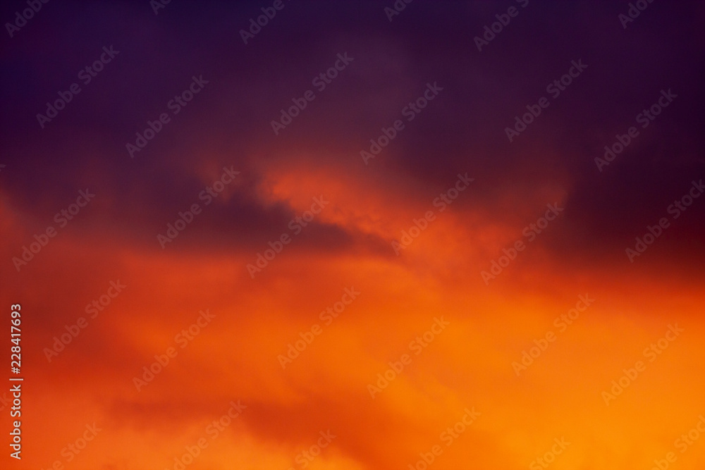 Fiery red and orange evening sky with a hint of blue and purple