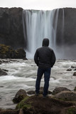 Man standing in front of Iceland Waterfall Gufufoss 