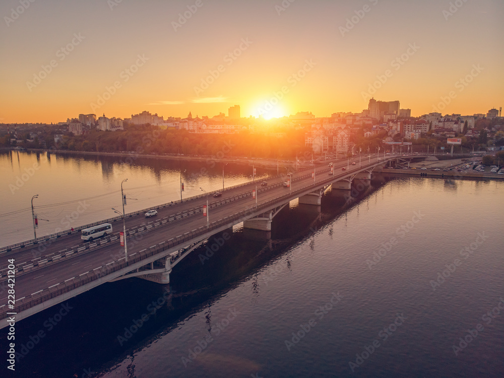Aerial view to Chernavsky bridge over big river at sunset and view to right bank of Voronezh city, Russia