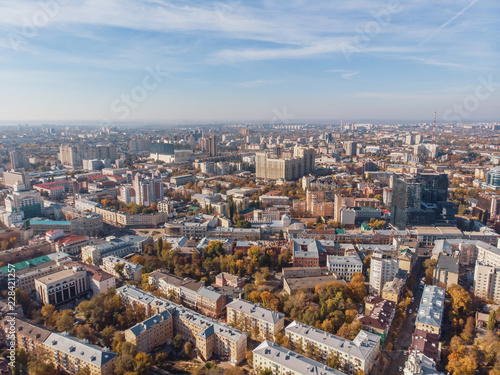Aerial drone shot of Voronezh downtown with buildings from above  parks  streets with cars in sunny autumn day