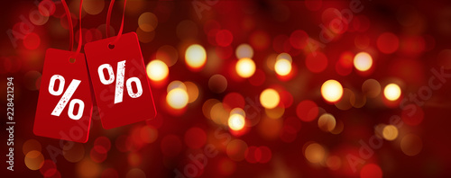 Bokeh Kulisse und Etiketten mit Prozent Zeichen - Rabatte zu Weihnachten, Cyber Monday
