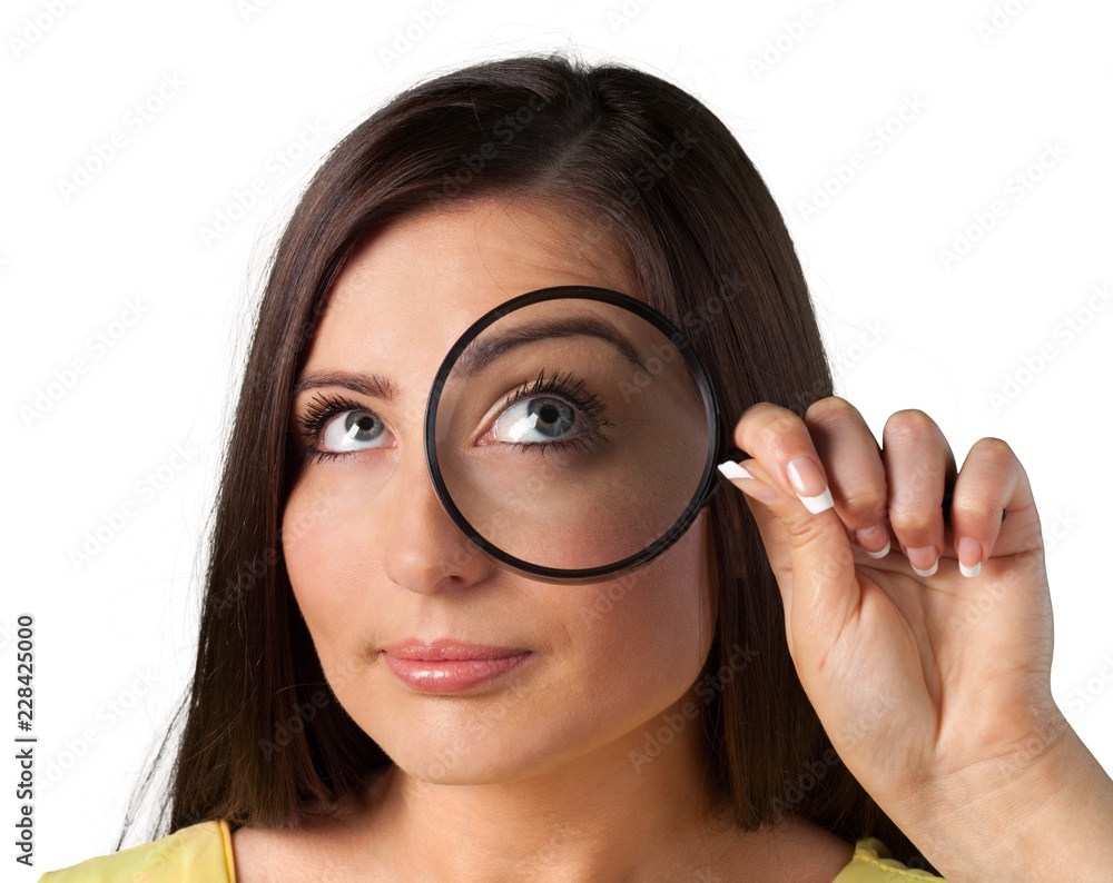 Woman holding magnifying glass isolated on white background Woman holding magnifying glass isolated on white background