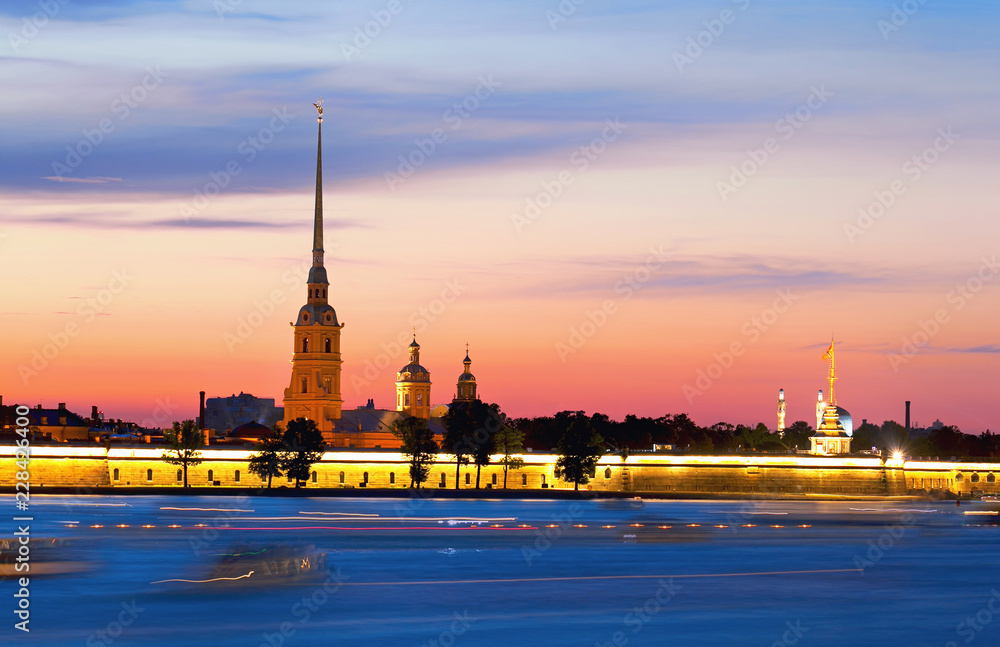 View of the Peter and Paul Fortress, White Nights, St. Petersburg, Russia. The movement of ships on the Neva River. Famous travel destination in Europe.
