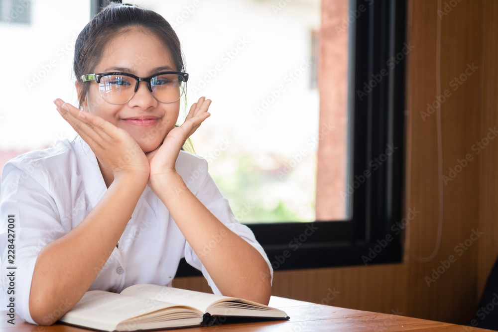cute girl sitdown smiled and look at camera in the room, children concept, education concept cute girl sitdown smiled and look at camera in the room, children concept, education concept