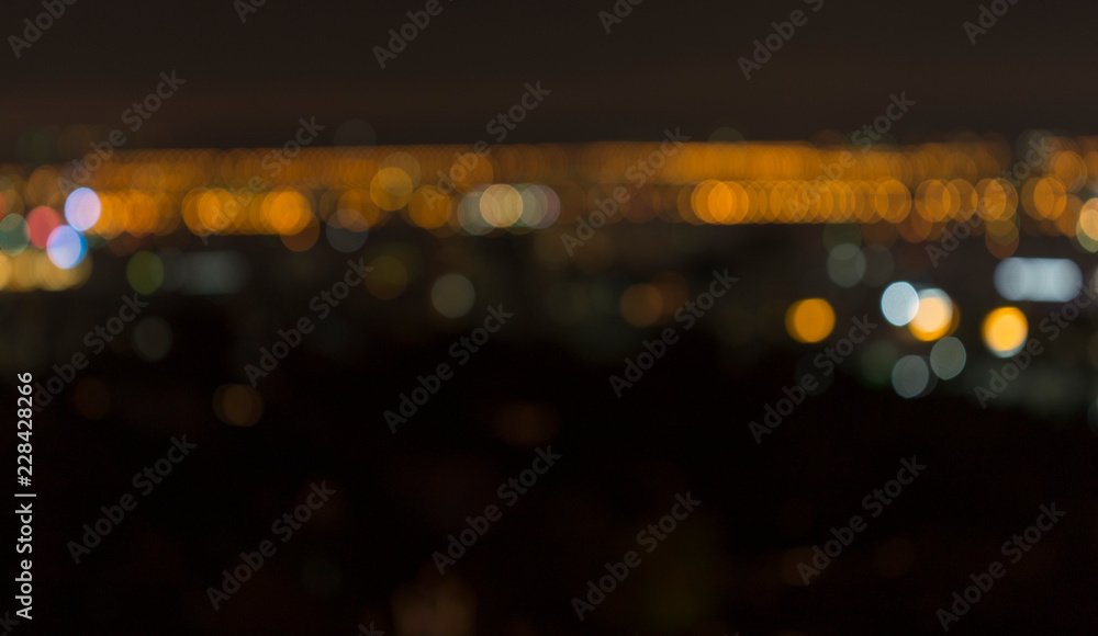 Blurred horizon of the city with a view of the bird's eye at night and skyscrapers in the center