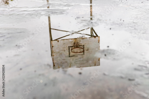 rain soaked basketball court © ashtone6
