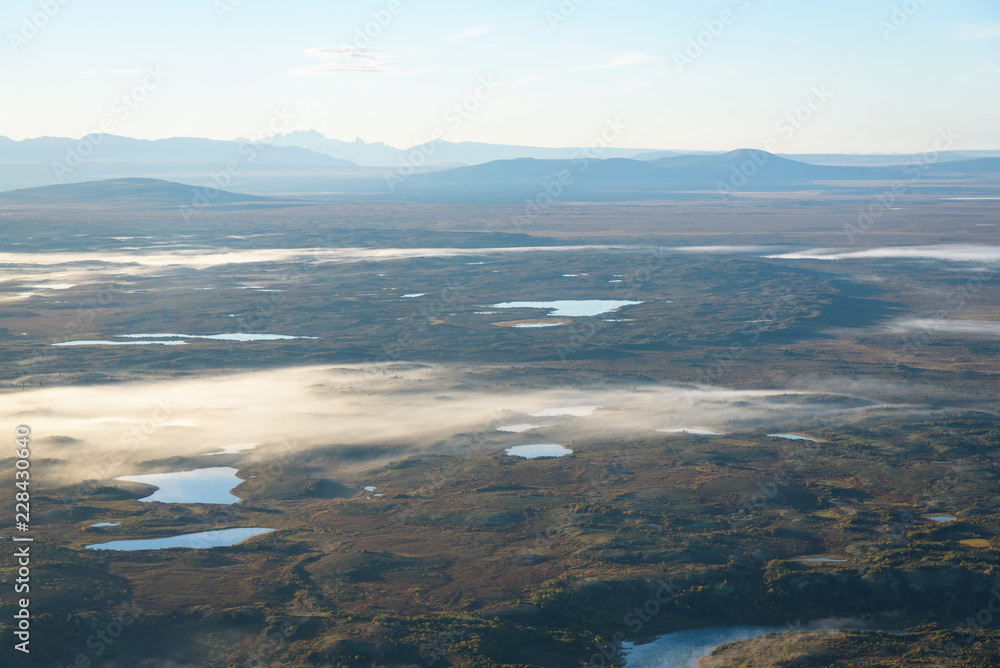 Aerial view of Alaskan foggy fall color landscape, rivers, lakes, mountains, tundra, Alaska, USA

