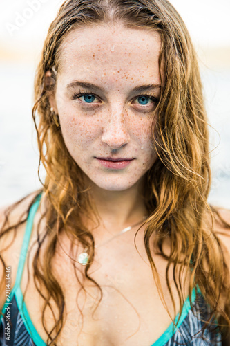 Young beautiful woman standing in a lake. © ashtone6