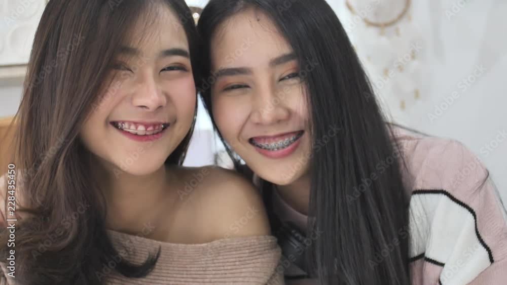 Slow motion of asian beautiful girl looking at a camera with smile face, Portrait of young cute asian teenage Slow motion of asian beautiful girl looking at a camera with smile face, Portrait of young cute asian teenage