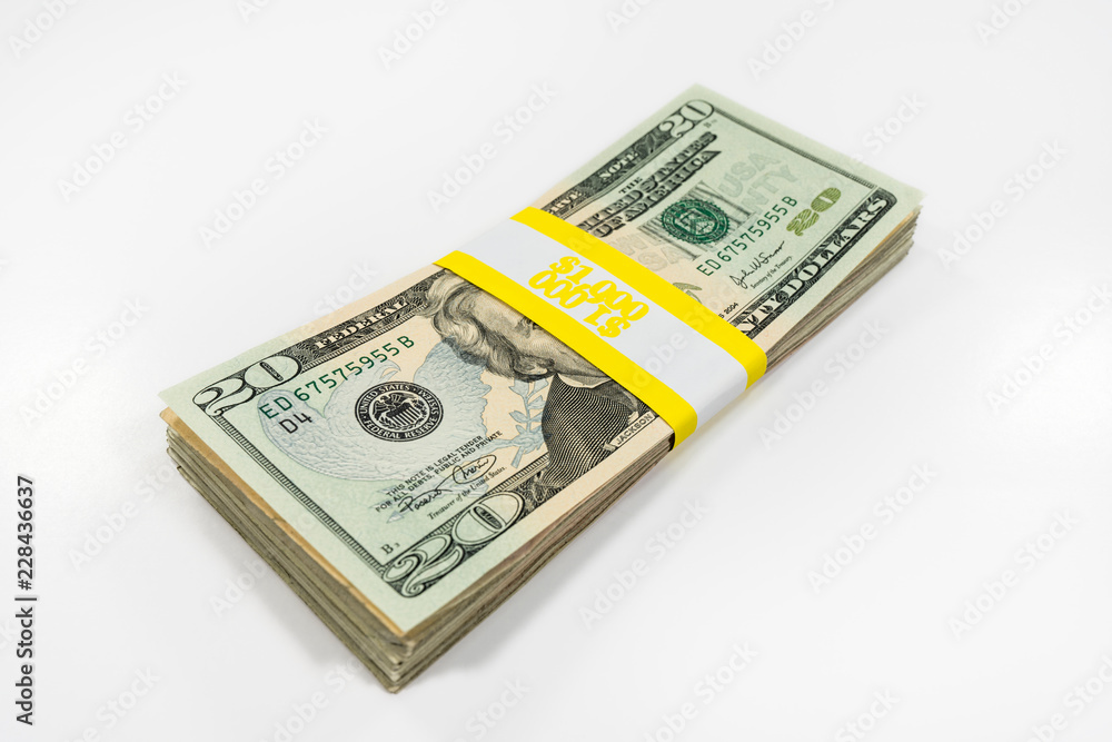 Pack of twenty dollar bills with $1000 paper currency strap. Stock