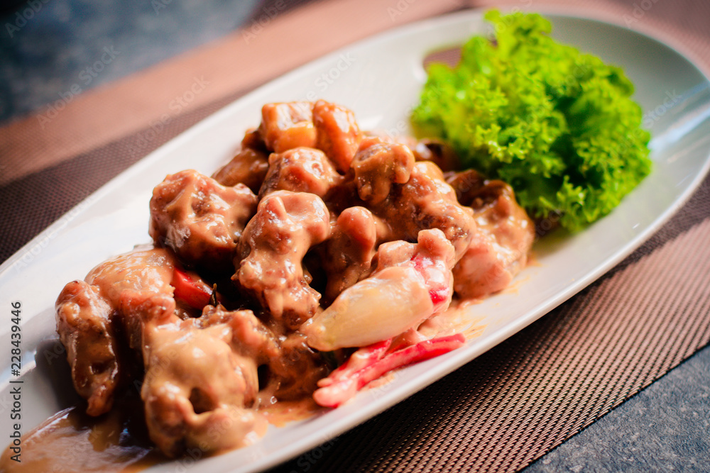 Rich stew of tender chicken pieces, cooked with a blend of ground spices and coconut milk. Rich stew of tender chicken pieces, cooked with a blend of ground spices and coconut milk.