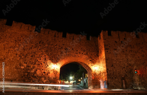 Medieval city walls in Rhodes town (night), Greece photo