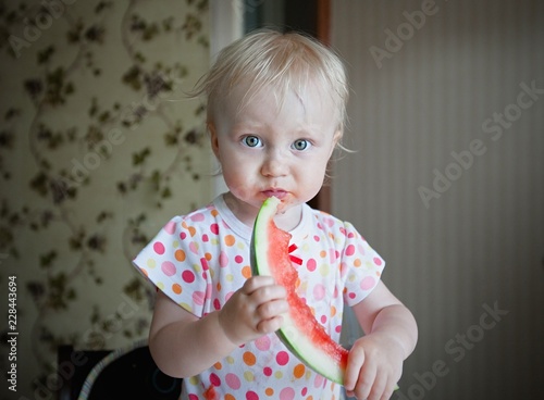 Little girl eating watermelon 