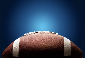 American football ball on background