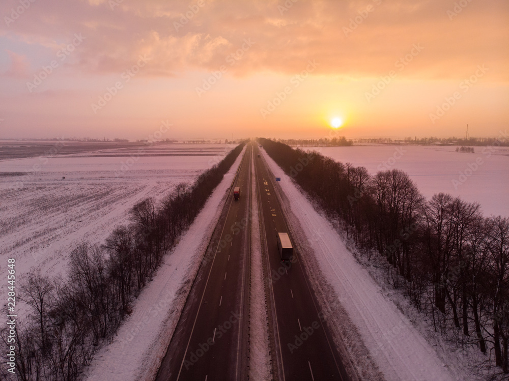 beautiful sunrise aerial view above highway. car travel concept