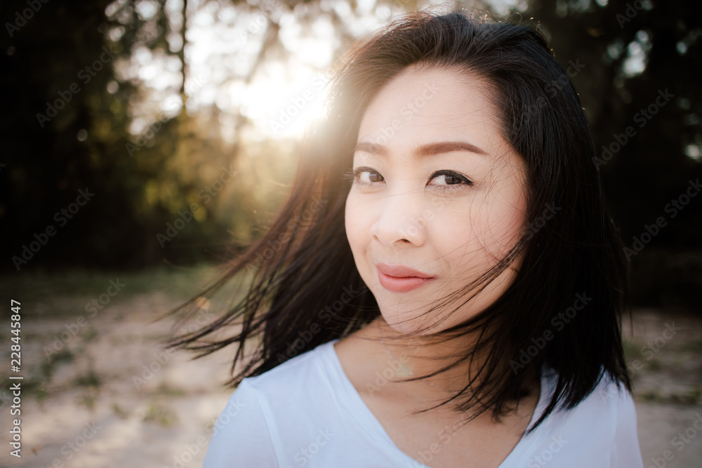Beautiful woman walk outdoor along with sand and pine under warm sunlight. Beautiful woman walk outdoor along with sand and pine under warm sunlight.