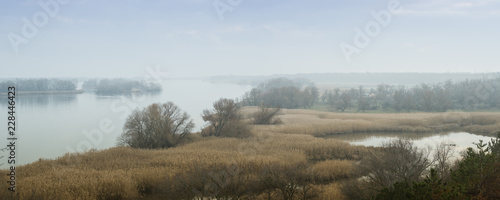 Panoramic view of the Dnieper River in a foggy haze. Beautiful autumn landscape. Zaporozhye region, Ukraine