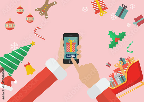 Santa Claus sending gift using smartphone with decorations and gift boxes