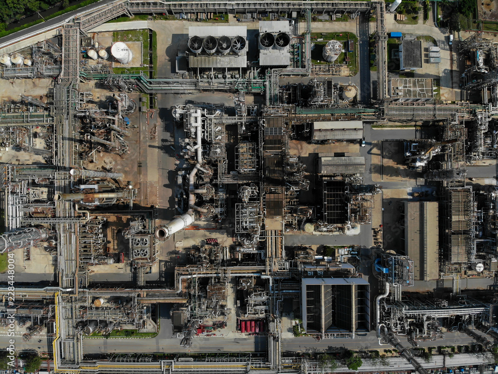 Metal Oil Storage Tanks, Crude Oil Production of oil refinery production at industrial estate / Countries of the World - LPG Above Ground Storage Tank - Bird's-eye view from drone