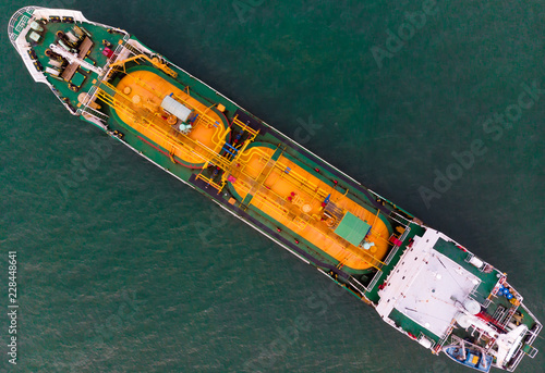 Aerial view of sea freight, Green,yellow oil tanker ship, Lpg, Cng at industrial estate Thailand / Crude Oil tanker to Port of Singapore - import export around in the world © AU USAnakul+