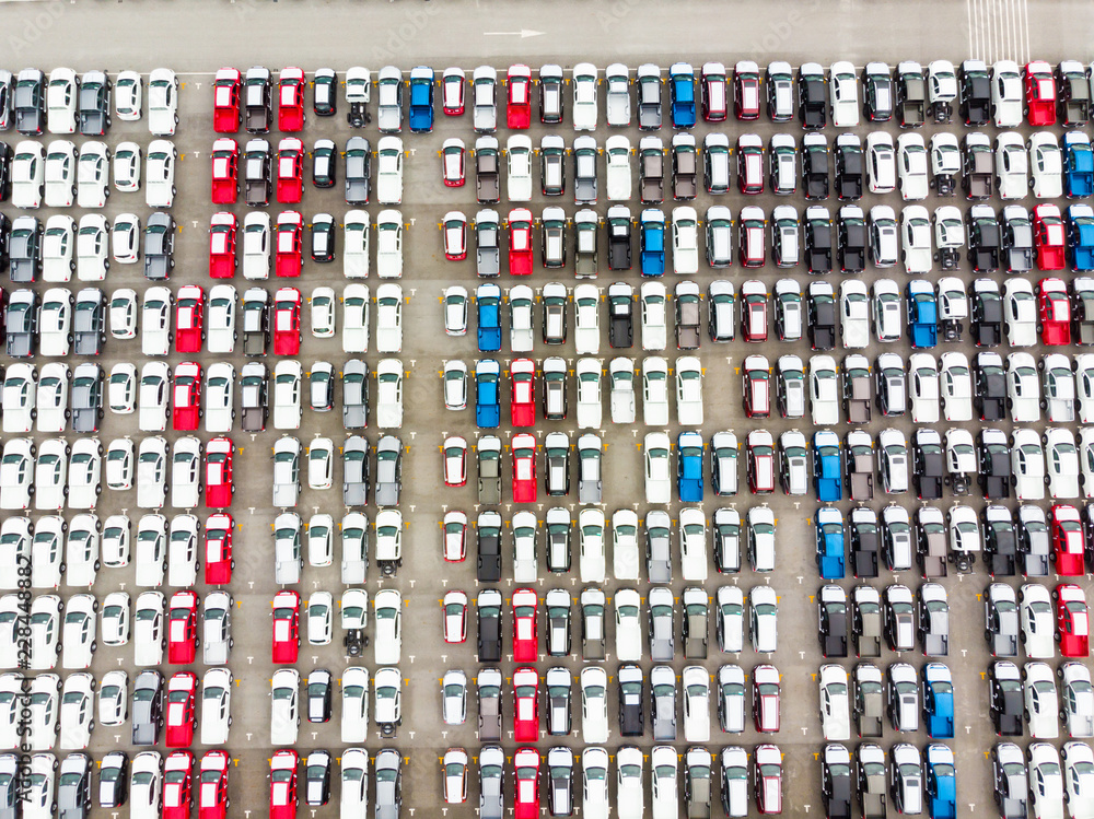 Aerial top view photo from flying drone, New Cars produced Several times a year at industrial estate for import export around in the world Aerial top view photo from flying drone, New Cars produced Several times a year at industrial estate for import export around in the world