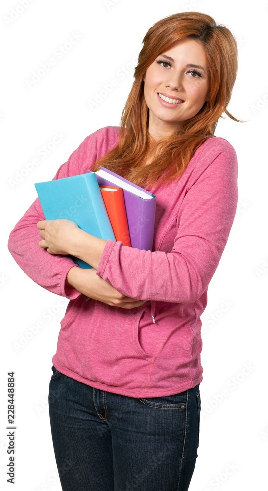 Redheaded woman carrying textbooks Redheaded woman carrying textbooks
