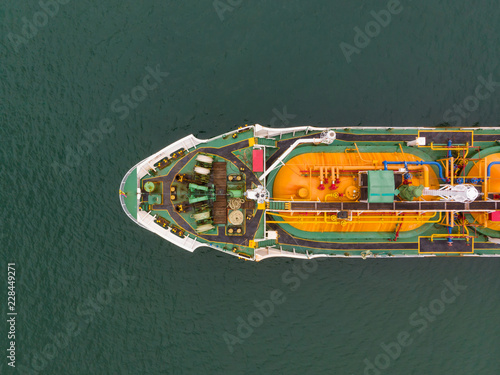 Aerial Top View of sea freight, Crude oil tanker lpg ngv at industrial estate Thailand / Crude Oil tanker to Port of Singapore - import export around in the world © AU USAnakul+