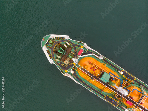 Aerial Top View of sea freight, Crude oil tanker lpg ngv at industrial estate Thailand / Crude Oil tanker to Port of Singapore - import export around in the world © AU USAnakul+