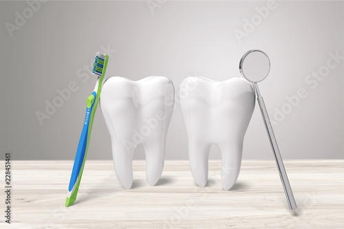 Big teeth  toothbrush and dentist mirror in