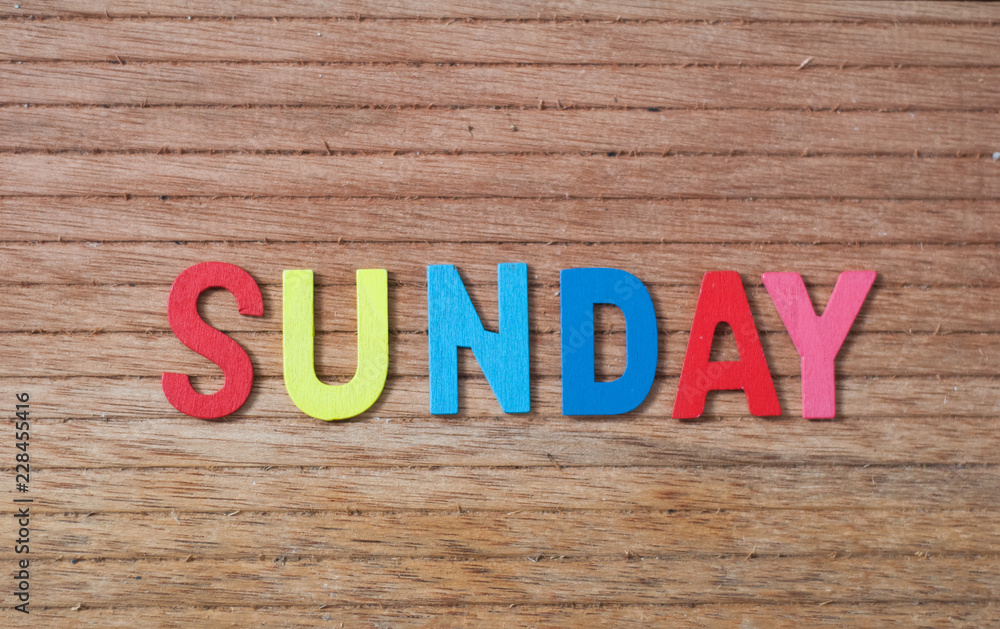 Fototapeta premium Colorful wooden alphabet with text sunday