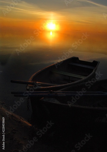 boat on lake at sunset