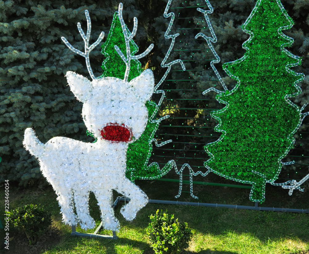 Christmas heroes figures reindeer and snowman composition over green fir