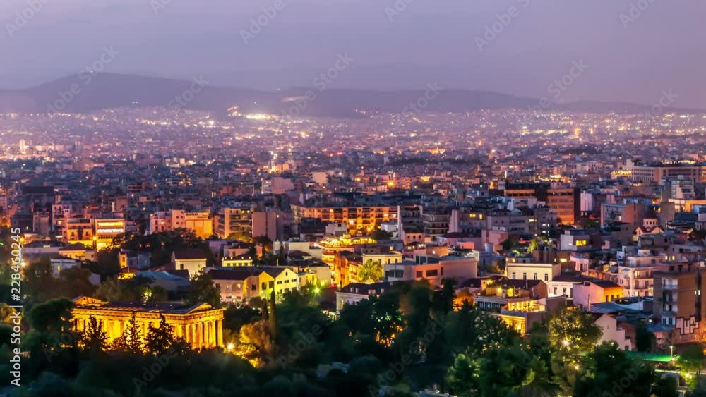 Panoramic view of Athens with Temple of Hephaestus. City skyline at dusk. Day to night time lapse video. City lights switch on. Panoramic view of Athens with Temple of Hephaestus. City skyline at dusk. Day to night time lapse video. City lights switch on.