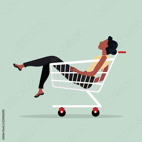woman sitting in shopping cart