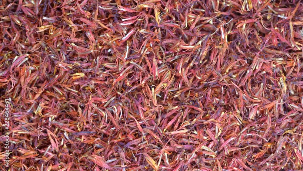 Saffron threads close up rotation loopable 4k top view. Food background. Gastronomy concept, organic food. Macro dried flowers and leaves saffron Saffron threads close up rotation loopable 4k top view. Food background. Gastronomy concept, organic food. Macro dried flowers and leaves saffron