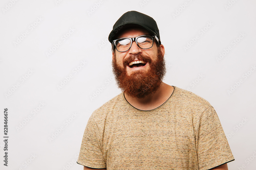Portrait of smiling bearded man over white bakcground Portrait of smiling bearded man over white bakcground