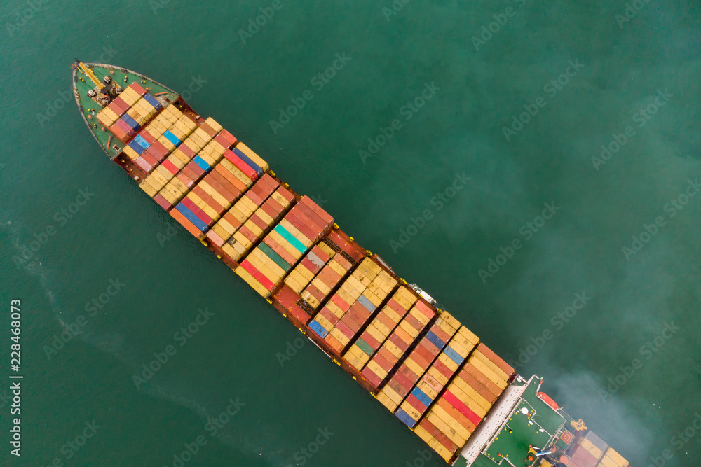 © AU USAnakul - Fresh colorful Containes, Business International trade and Container logistics export-import harbor to the International port / Shipping Containers concept. - Aerial top view from drone.
