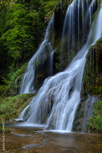 Fototapeta Naklejka Na Ścianę i Meble -  French landscape - Jura. Waterfall in the Jura mountains after heavy rain.