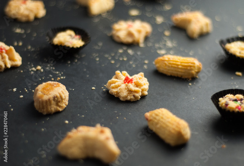 Cookies or biskut raya on black background. Special food for Eid festival or Hari raya